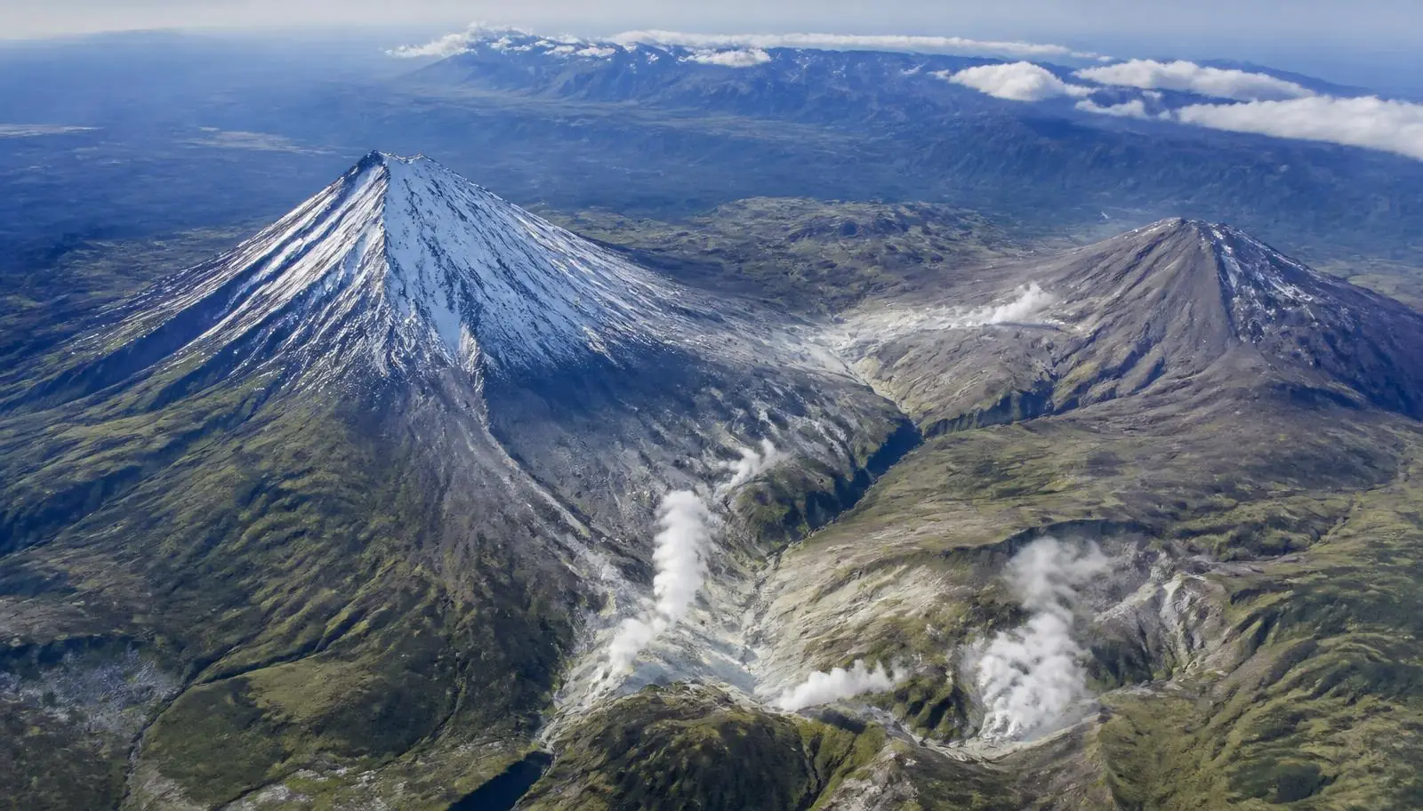 Aerial view of an Ecuadorian volcanic range with geothermal steam fields